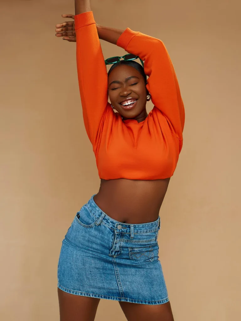 denim skirt with orange blouse